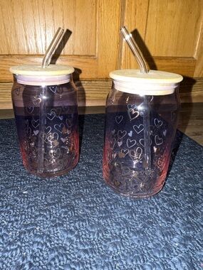 Gently used. Set of two glass cups with lids and straws